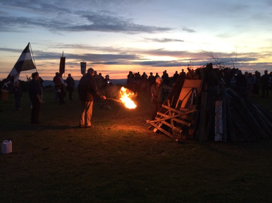 Lighting the bonfire at the Midsummer Eve celebration, Kit Hill, Cornwall